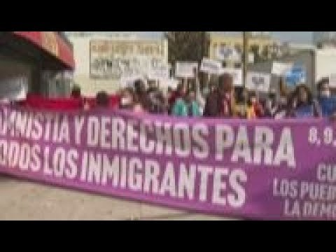 Immigrant rights activists demonstrate at summit